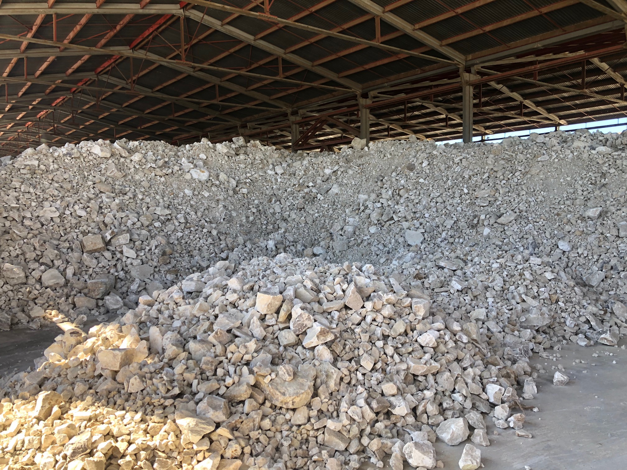 Raw zeolite stockpile at the factory